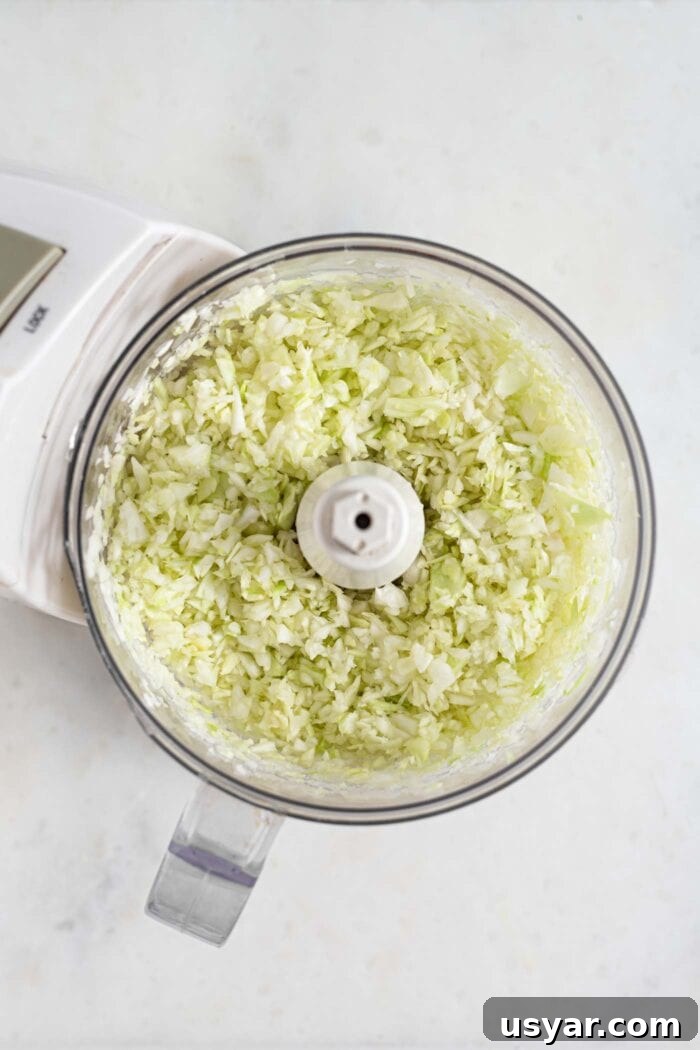 Finely chopped cabbage in a food processor.