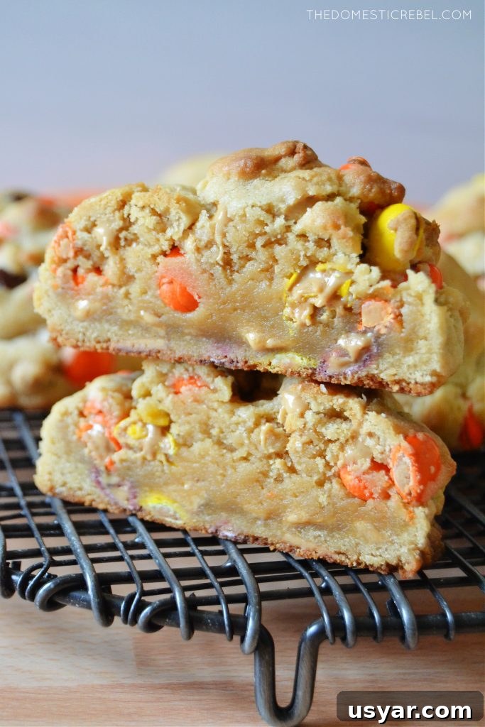a stack of peanut butter cookies split open