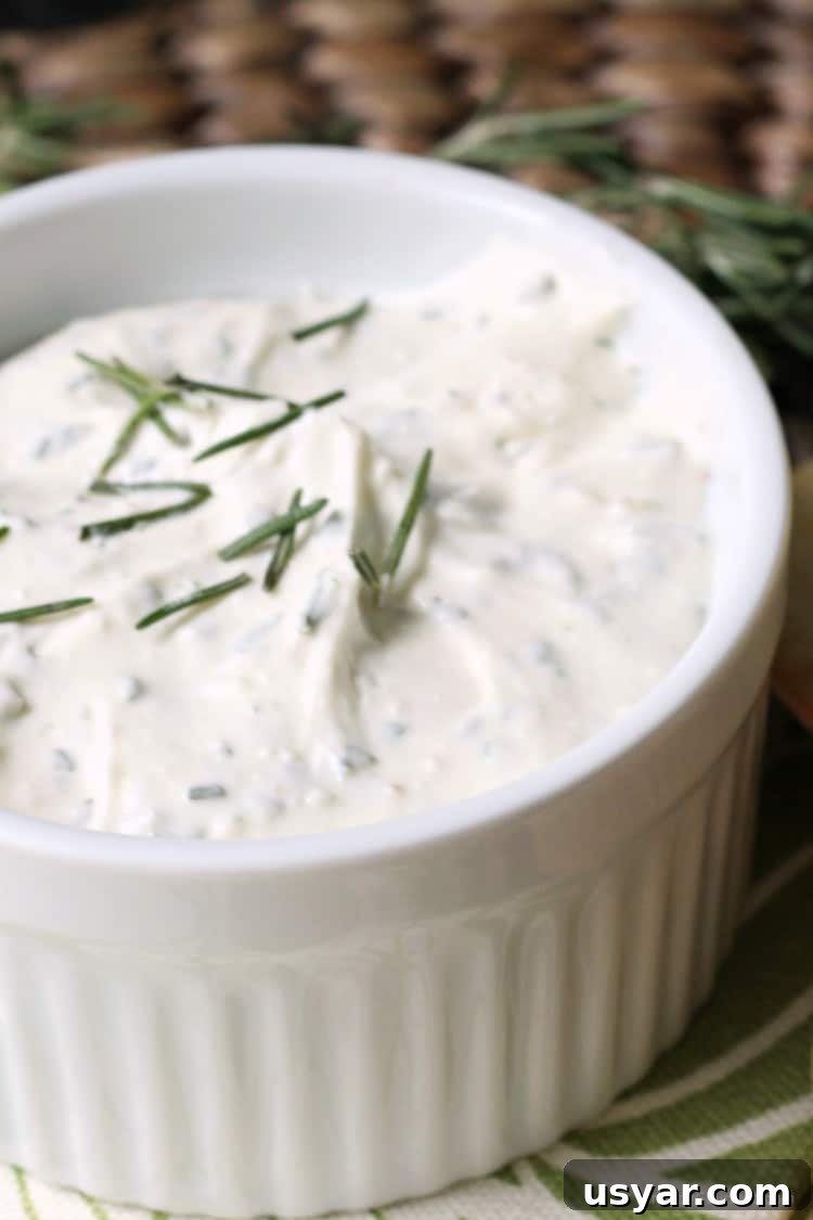 Feta Spread with Rosemary and Lemon recipe - feta cheese spread with fresh ingredients for a delicious Greek and Italian appetizer feta spread in white bowl with fresh rosemary