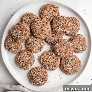 Crispy Sesame Seed Cookies Recipe 18 Plate full of multi-colored sesame seed cookies.