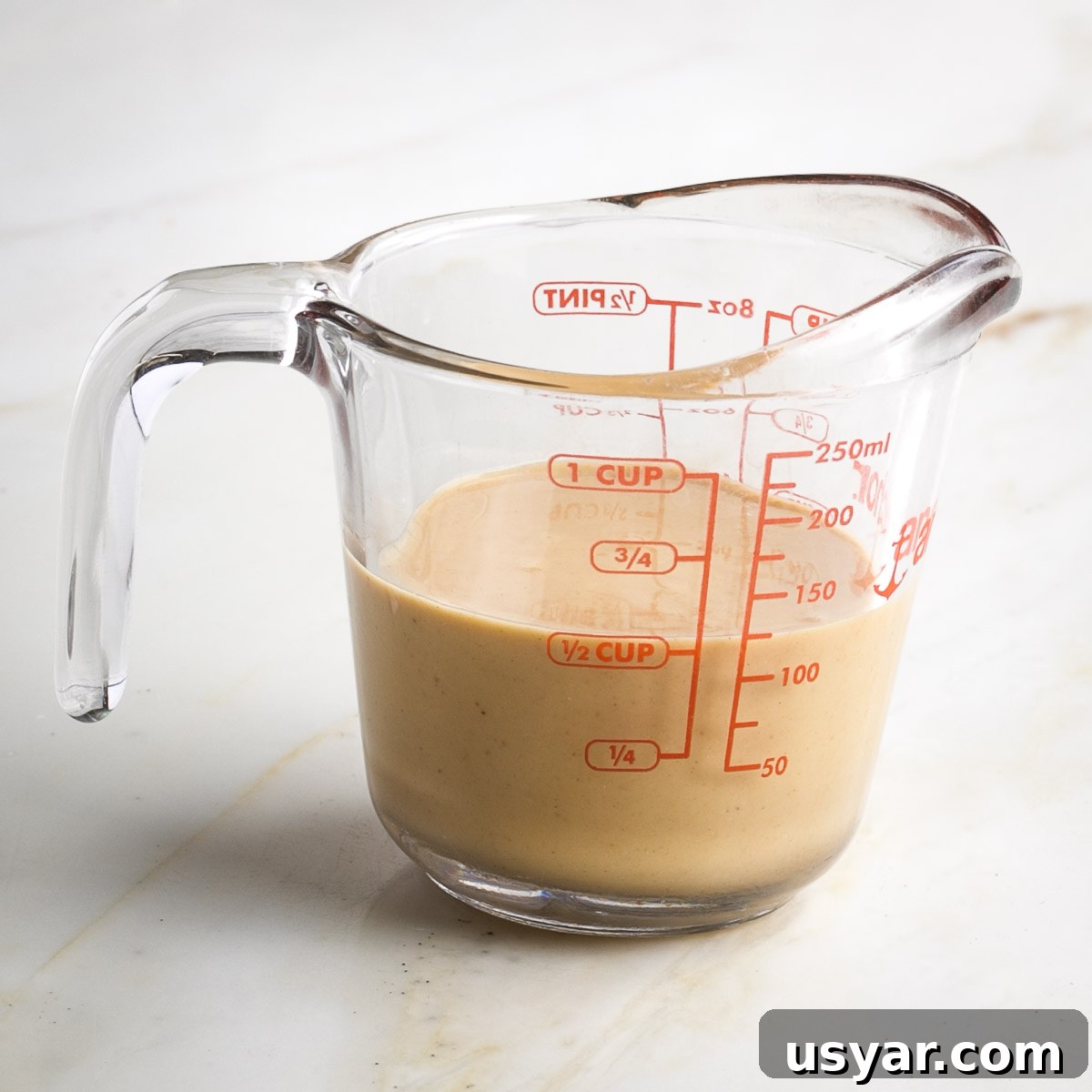 Crispy Sesame Seed Cookies Recipe 4 Pyrex measuring cup with ½ cup tahini.
