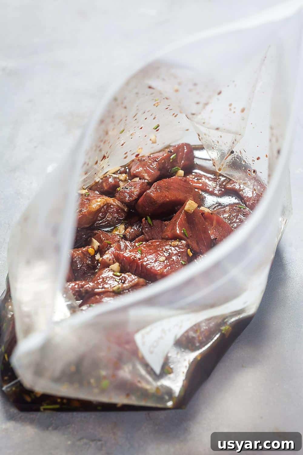 steak tips in a bag with marinade