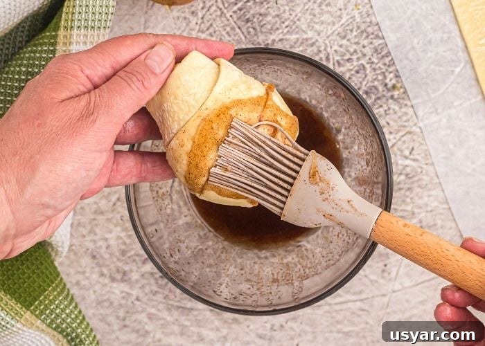 Crispy Honey-Glazed Pears in the Air Fryer 5 Brushing the melted butter and brown sugar mixture on the pear after it's been wrapped in puff pastry.