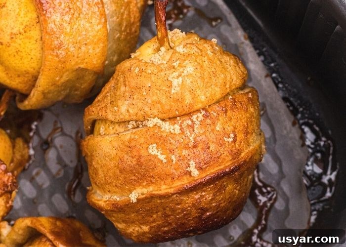 Crispy Honey-Glazed Pears in the Air Fryer 7 Golden crispy pastry wrapped pear, cooked in the air fryer basket.