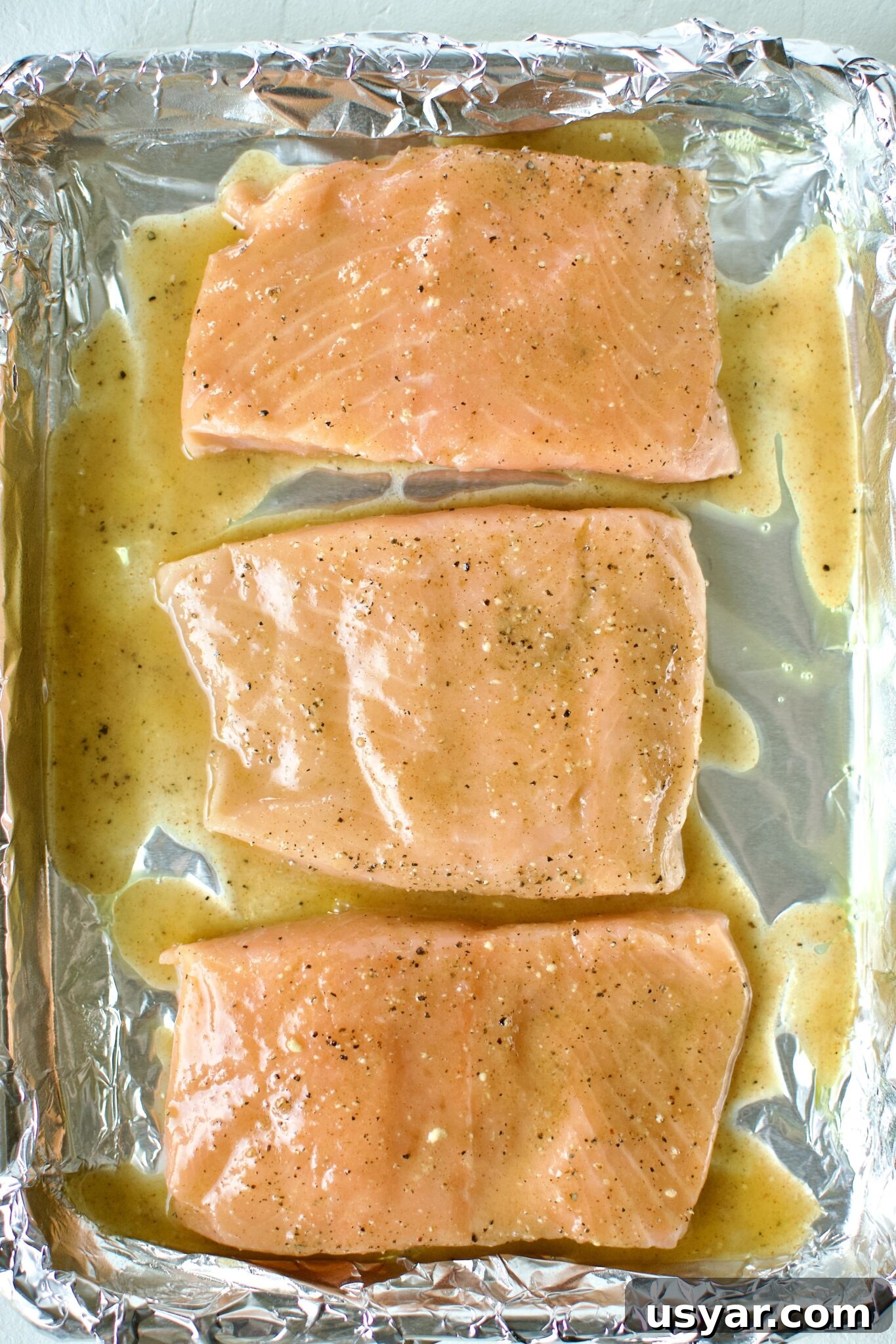 Salmon fillets with glaze on top.