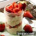 Peanut Butter Mousse and Strawberry Parfaits 6 peanut butter mousse in mason jar with strawberries