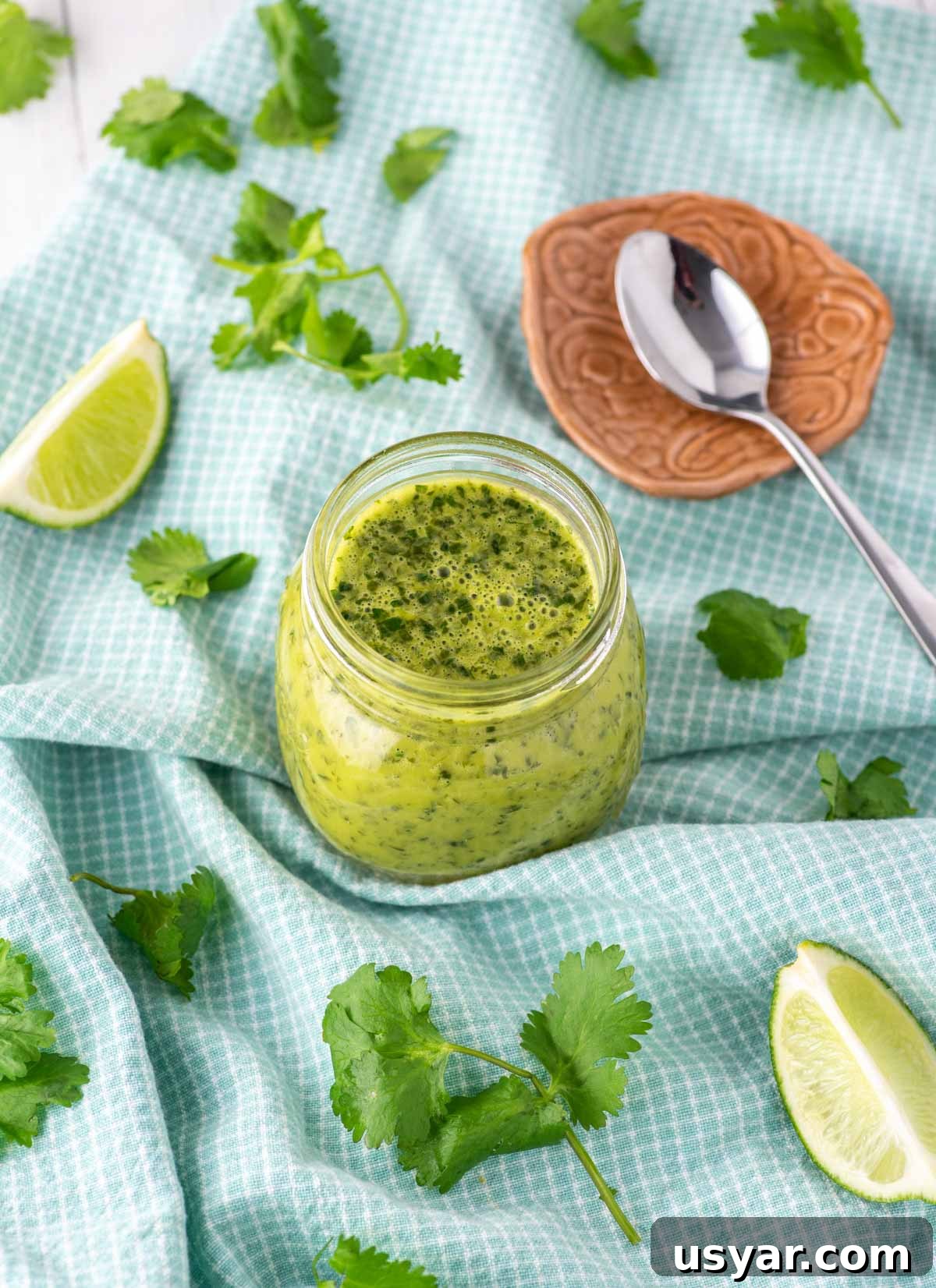 Zesty Cilantro Lime Vinaigrette Recipe 3 cilantro lime vinaigrette in glass jar on dish towel
