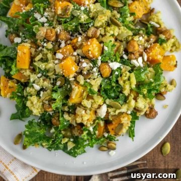 Zesty Cilantro Lime Vinaigrette Recipe 7 overhead shot of kale cauliflower salad on white plate with fork