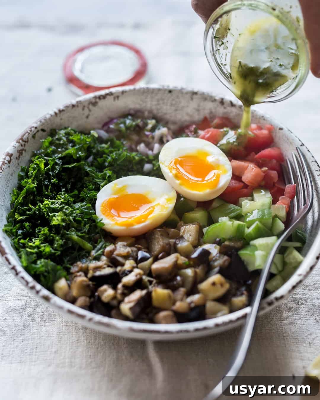 Healthy chopped salad with sautéed eggplant and dill vinaigrette