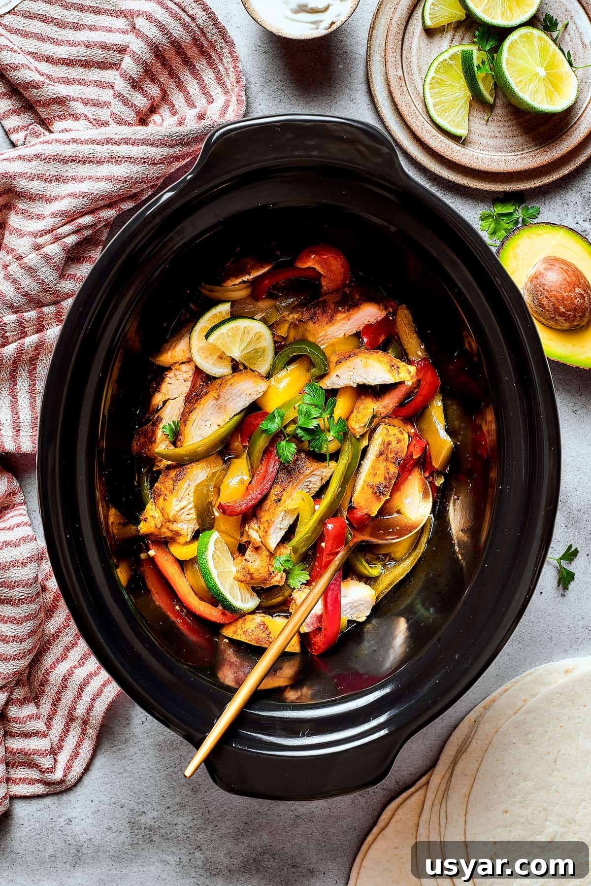 These perfectly-seasoned Crockpot Chicken Fajitas are easy to make, perfect for busy days when you want a home-cooked meal without the hassle! A slow cooker of Southwest-style chicken with bell peppers and onions.