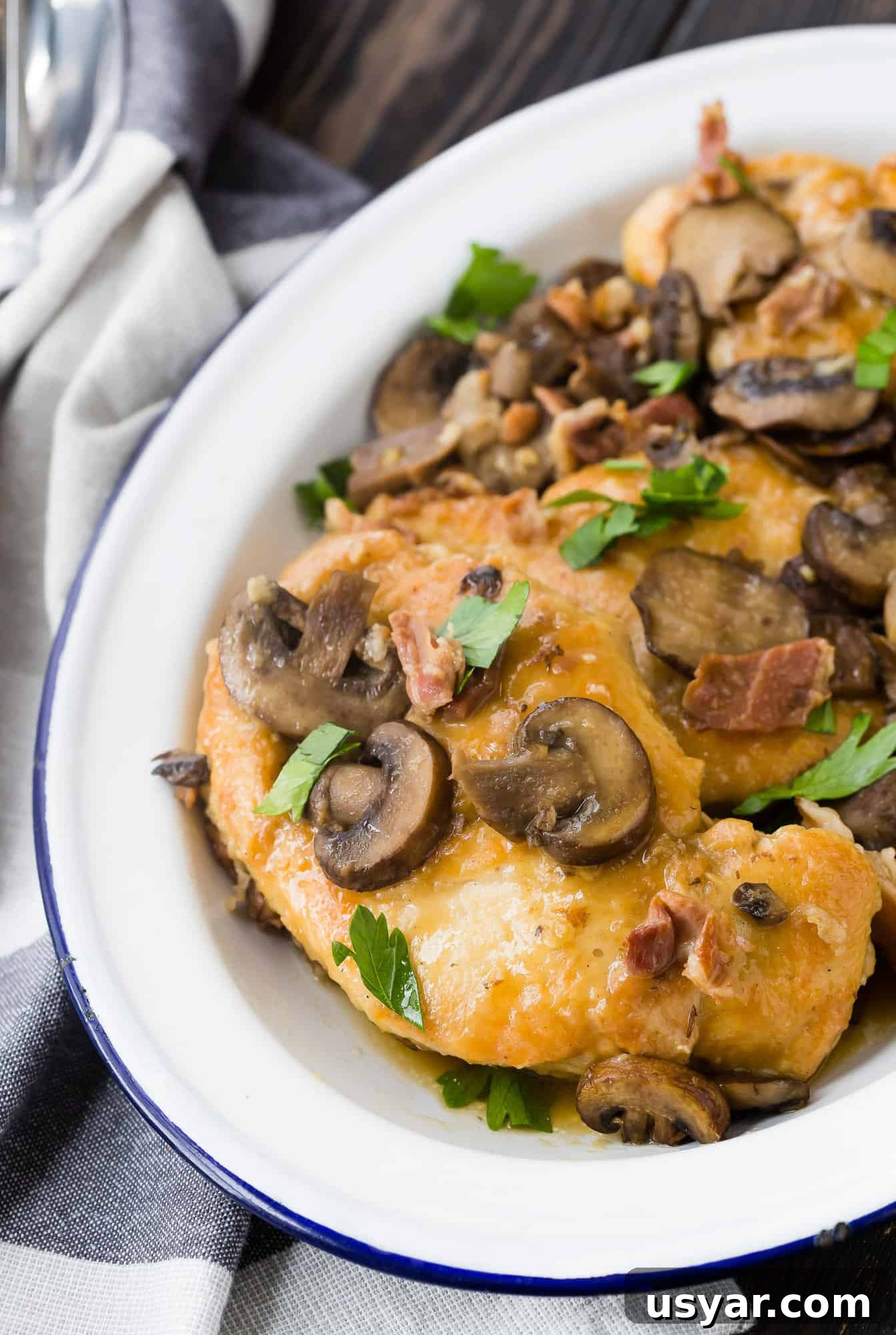 Instant Pot Chicken Marsala has all the flavors of marsala that you know and love, but with the convenience of cooking in the Instant Pot. You'll adore how quickly it comes together and you'll find yourself coming back to this recipe time and time again. It's great served with pasta or rice! Instant pot chicken marsala on white platter.