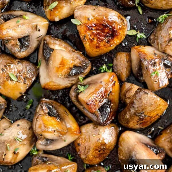 Instant Pot Chicken Marsala in 30 Minutes 8 Sautéed mushrooms with marsala close up, sprinkled with herbs.