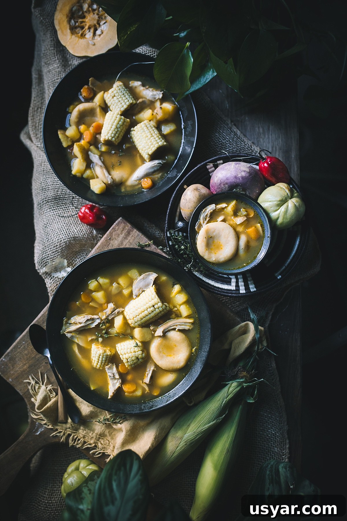 Authentic Jamaican Chicken Soup with Dumplings 2 overhead shot of Jamaican chicken soup with dumplings, corn, potatos, and carrots