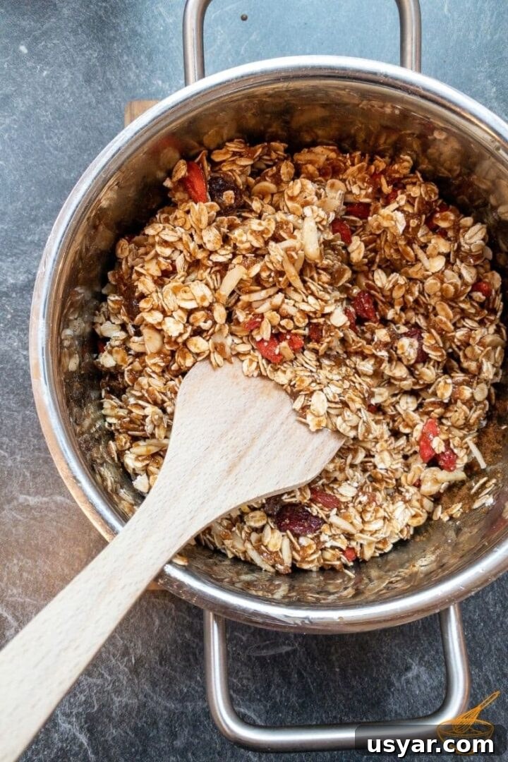 Homemade Biscoff Granola Recipe with Cookie Butter Swirl 3 Add all dry ingredients to the liquefied honey.