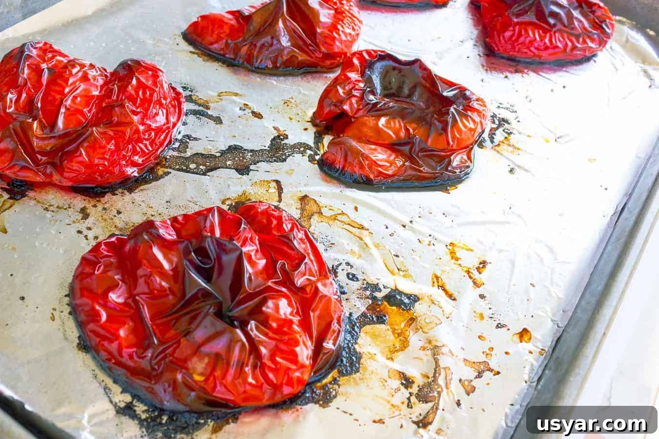 How to Roast Red Peppers at Home 4 Roasted red peppers cut side down on a cookie sheet