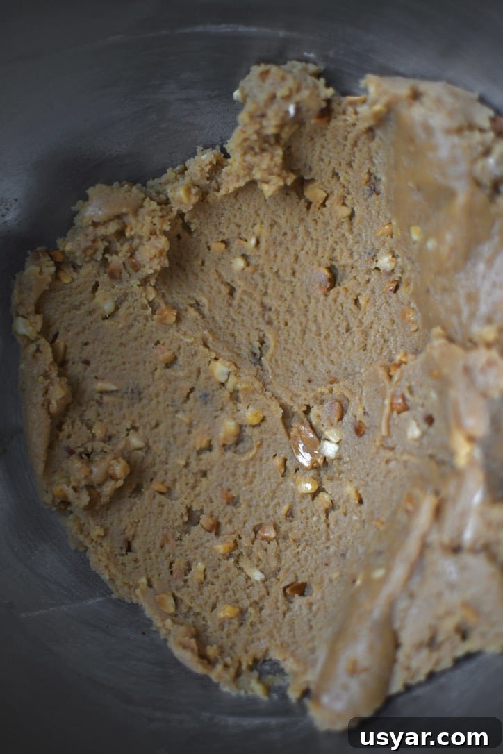 Decadent Peanut Butter Mousse Recipe 4 Whipped cream cheese, peanut butter, and vanilla in a stand mixer bowl.