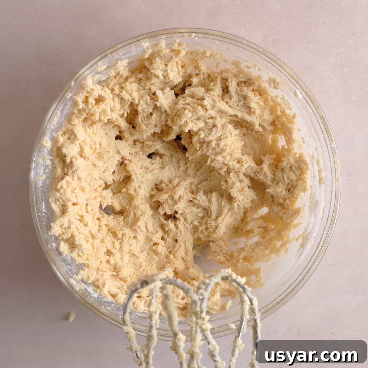 How to Make Chewy Salted Caramel Oatmeal Cookies 6 Dry cookie ingredients mixed into the wet ingredients with a hand mixer.
