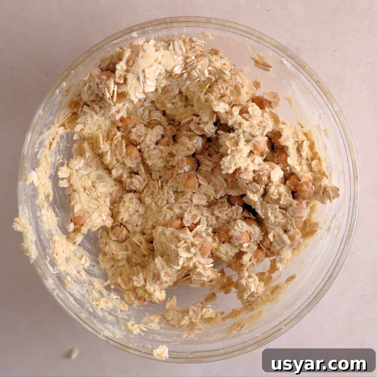 How to Make Chewy Salted Caramel Oatmeal Cookies 7 Old fashioned oats and caramel bits mixed into cookie dough.