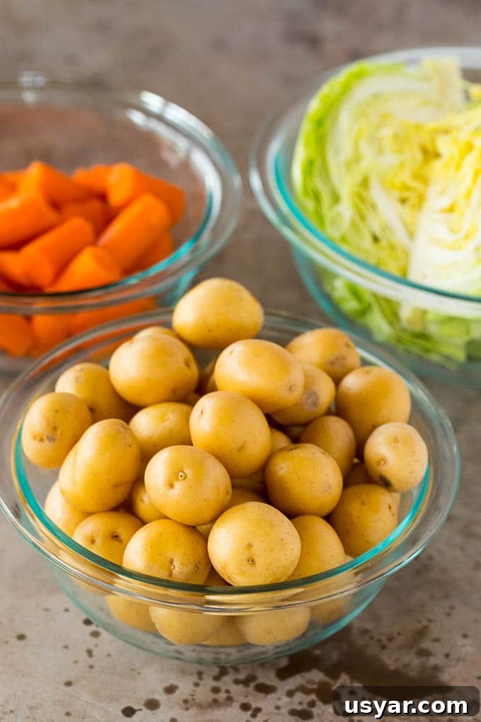 Bowls of potatoes, cabbage and carrots.