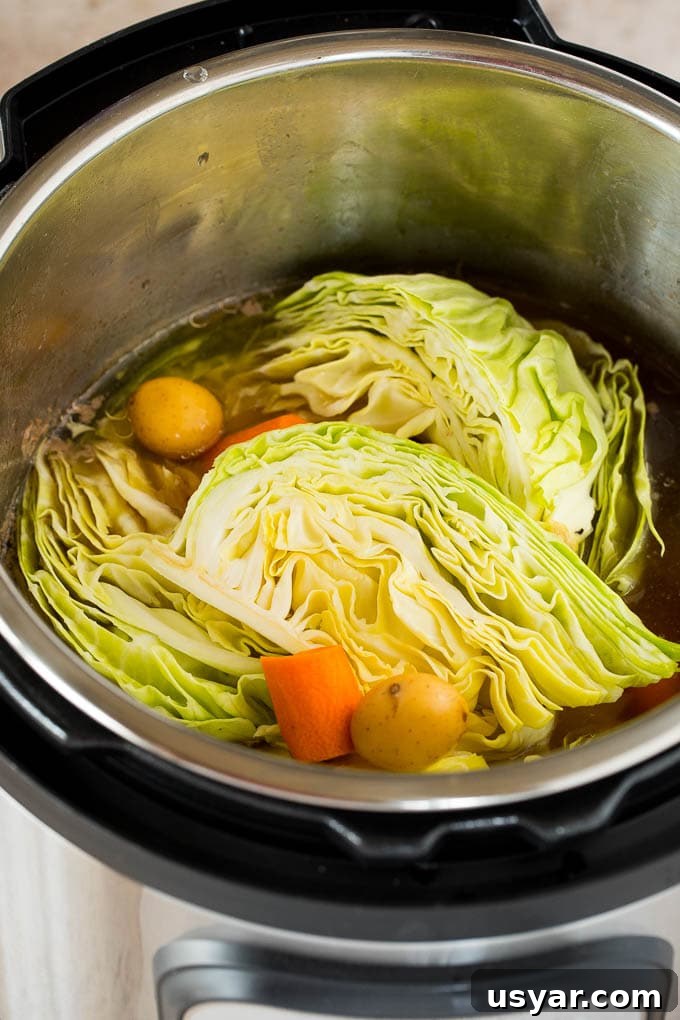 Potatoes, sliced carrots and vegetables in an Instant Pot.