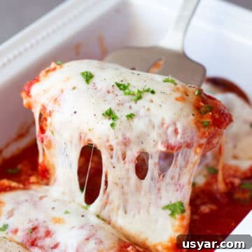 Baked Chicken Caprese with Mozzarella and Tomatoes 16 Spatula filled with chicken breasts topped with melted provolone cheese topped with fresh basil.