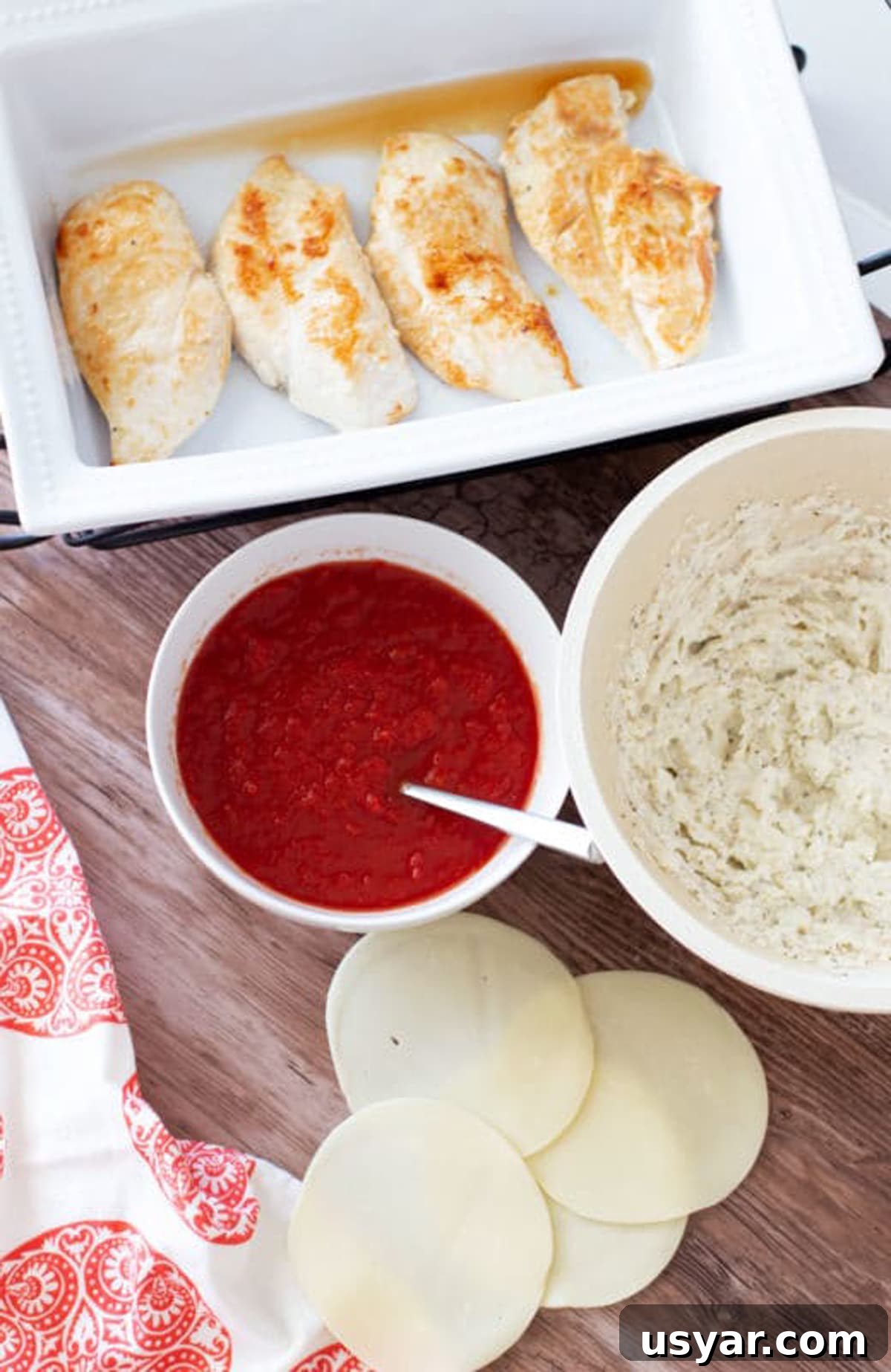 Baked Chicken Caprese with Mozzarella and Tomatoes 6 Baking dish with sauteed chicken breasts, crushed tomatoes, ricotta cheese and 4 slices of Provolone cheese.