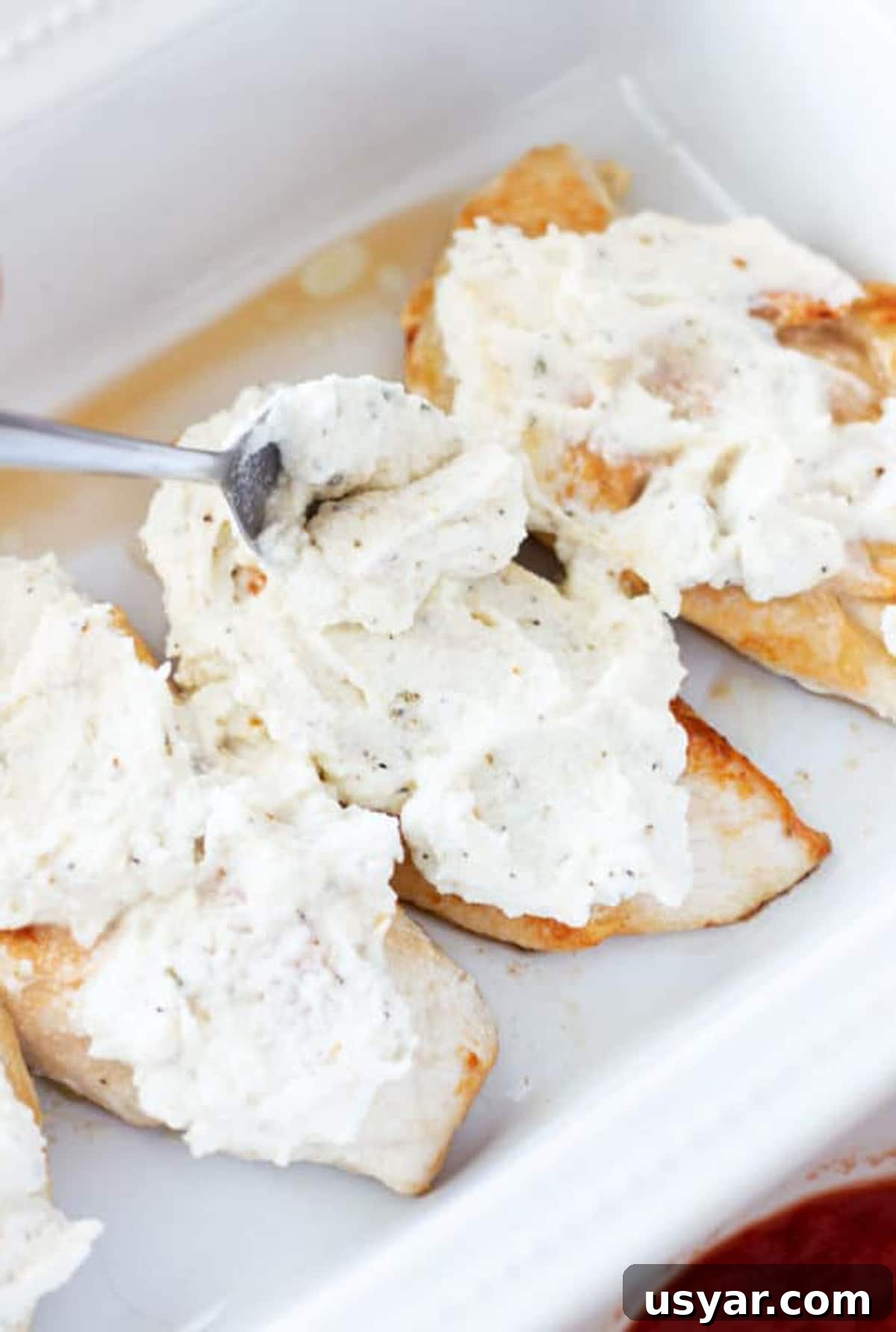 Baked Chicken Caprese with Mozzarella and Tomatoes 7 Spoonful of ricotta cheese topping chicken breasts.