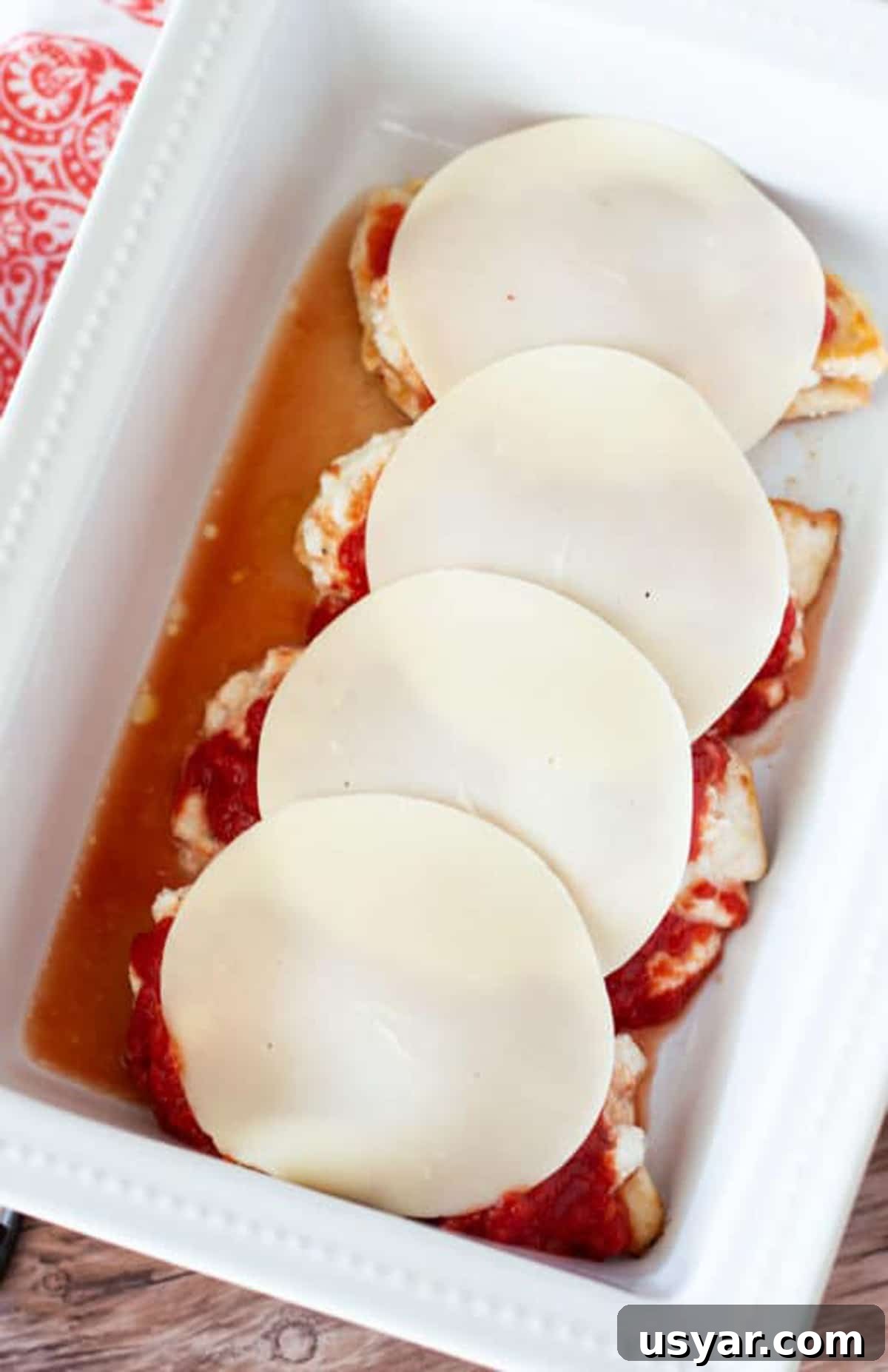 Baked Chicken Caprese with Mozzarella and Tomatoes 9 4 pieces of sauteed chicken covered with ricotta cheese, crushed tomatoes and Provolone cheese.