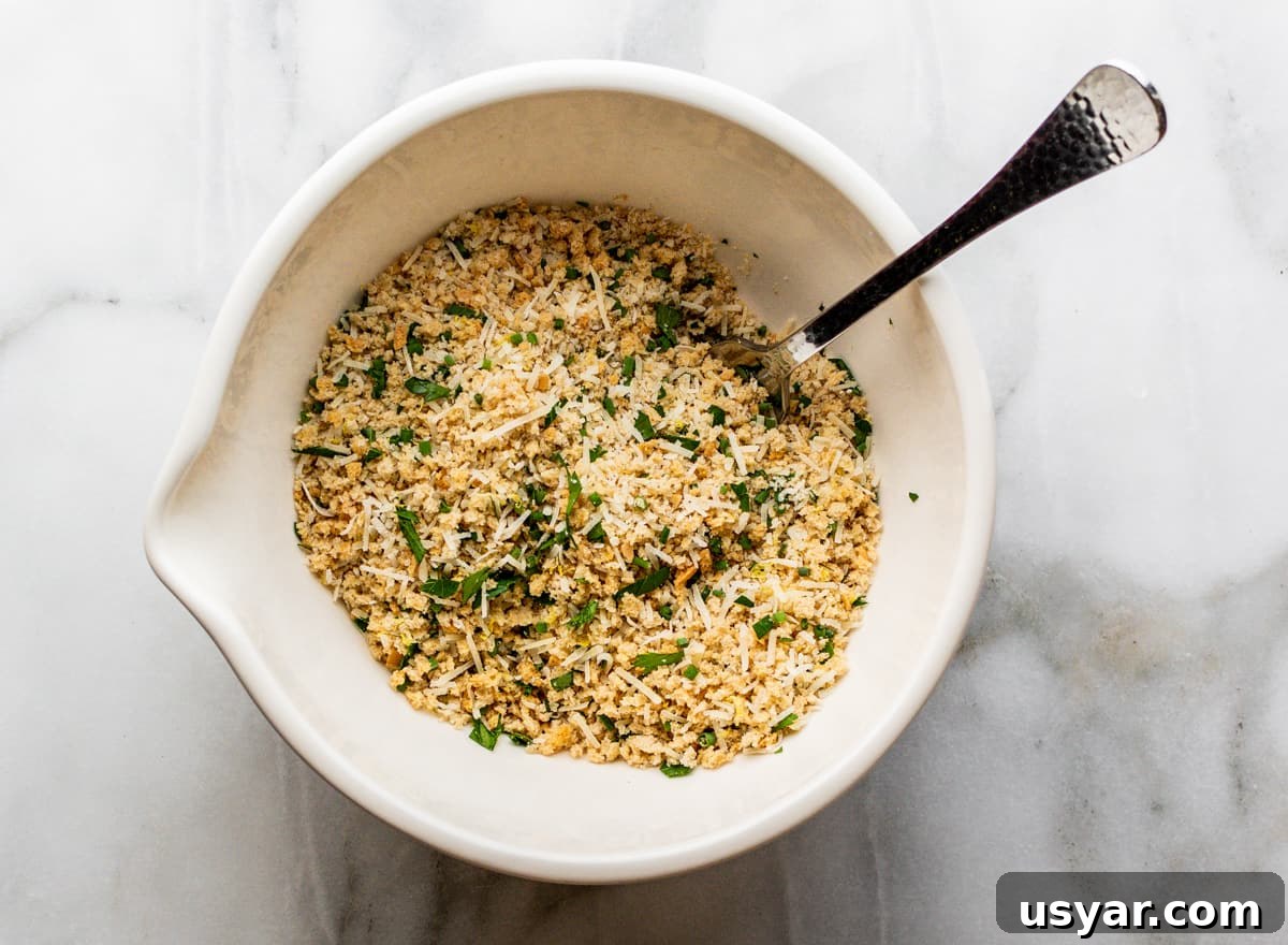 Parmesan Baked Cod with Garlic and Lemon 8 parmesan and breadcrumb mixture in bowl with spoon.