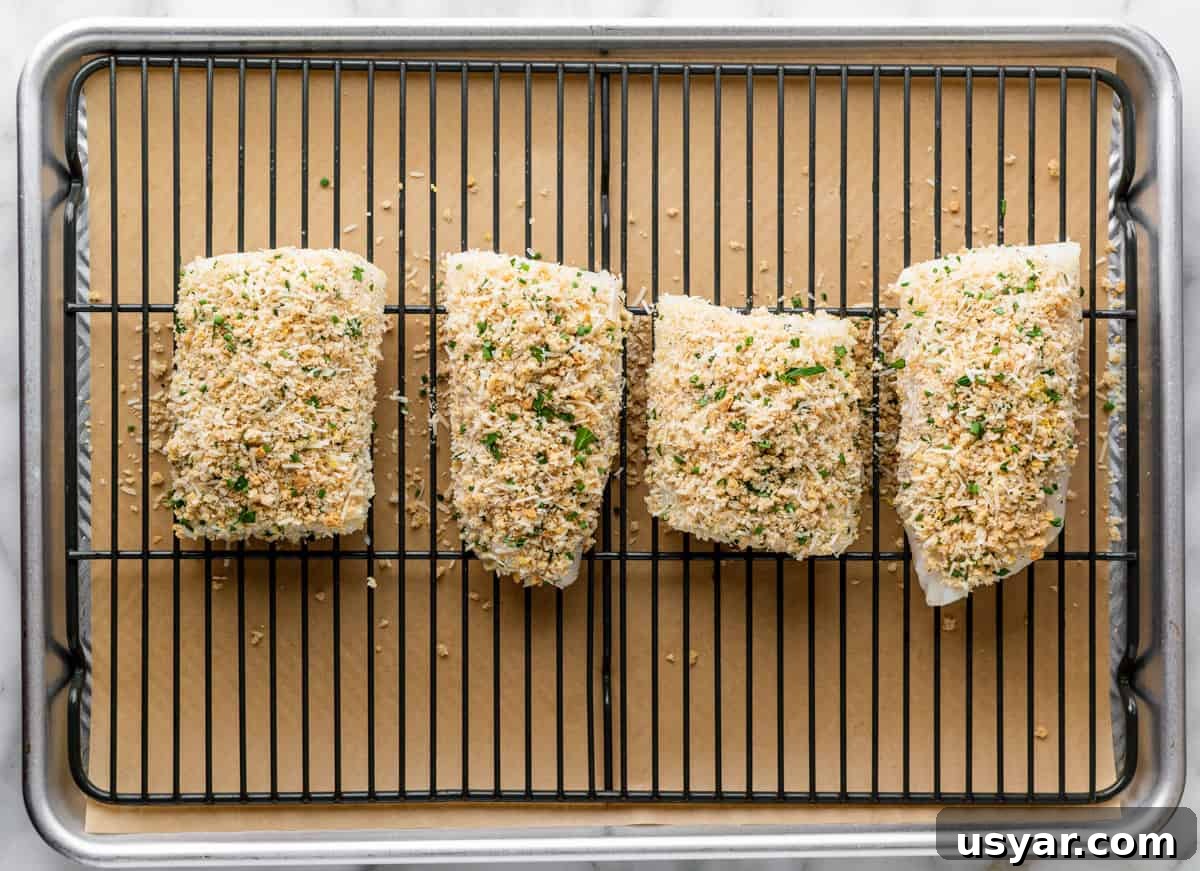 Parmesan Baked Cod with Garlic and Lemon 9 cod topped with parmesan mixture before baking.