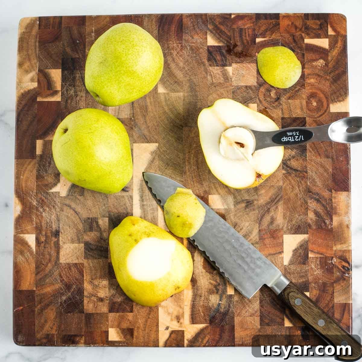 Oven Baked Pears with Almonds and Dark Chocolate 7 Pears, sliced through center, core scooped out, sliver cut off outside so halves can have stability.