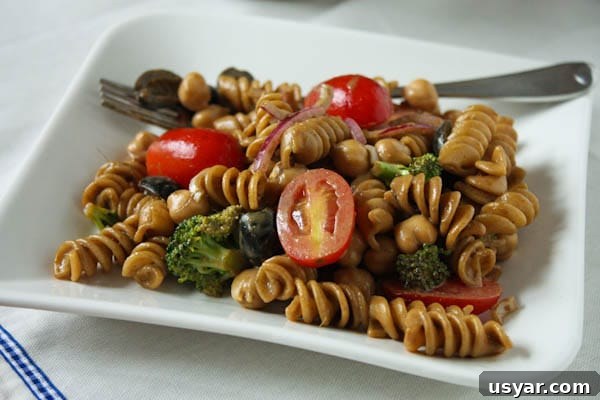 Pasta Salad with Balsamic Basil Vinaigrette pasta salad on plate with fork