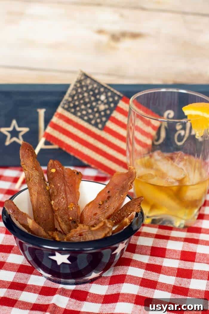 Citrus Bourbon Turkey Jerky Recipe 12 Citrus Bourbon Jerky with flag and bourbon in a glass
