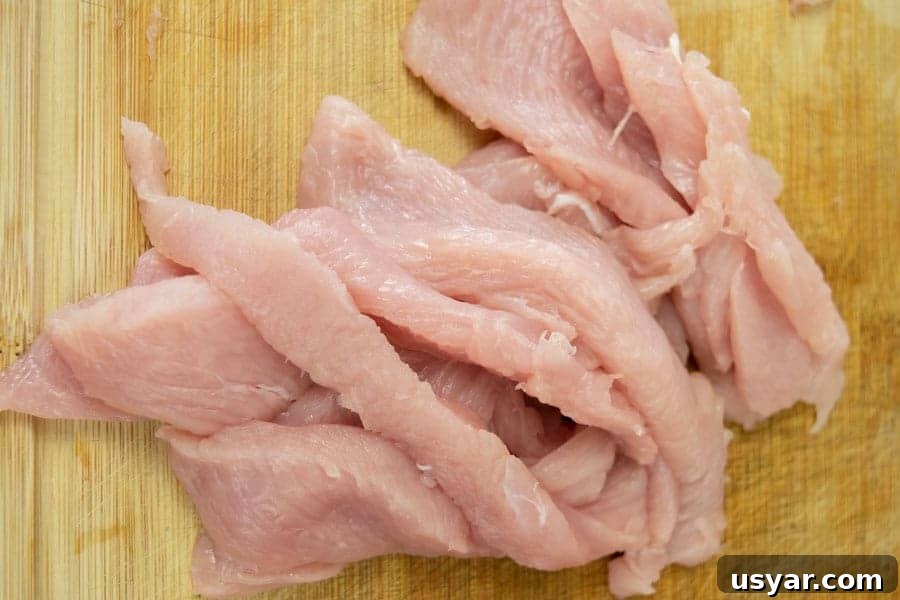 Citrus Bourbon Turkey Jerky Recipe 4 Turkey breast sliced for jerky on cutting board