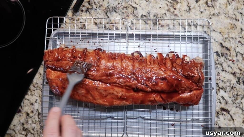 Brushing char siu sauce onto ribs