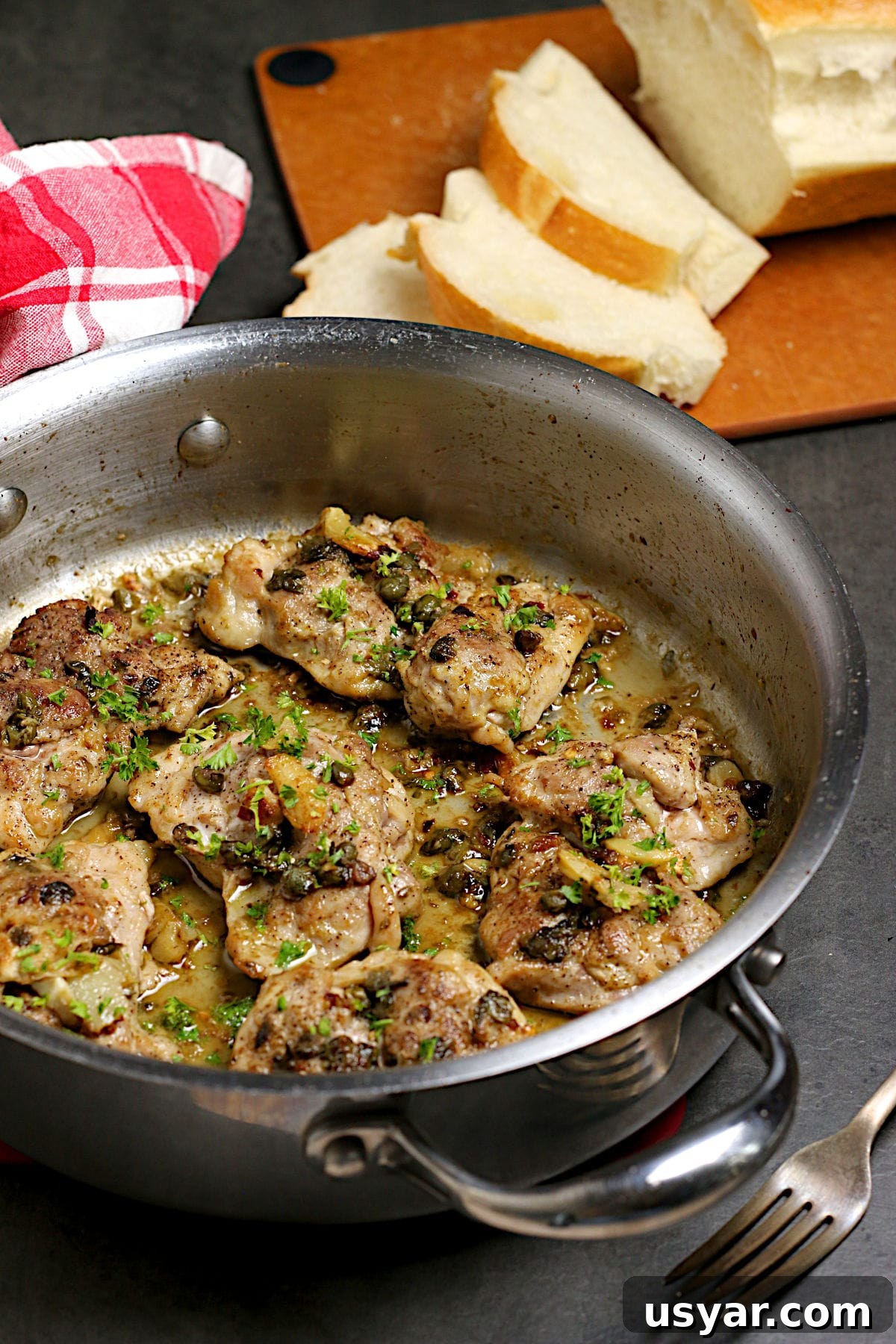 Hot Honey-Glazed Chicken Thighs Recipe 6 Chicken thighs with anchovies and capers in a saute pan.