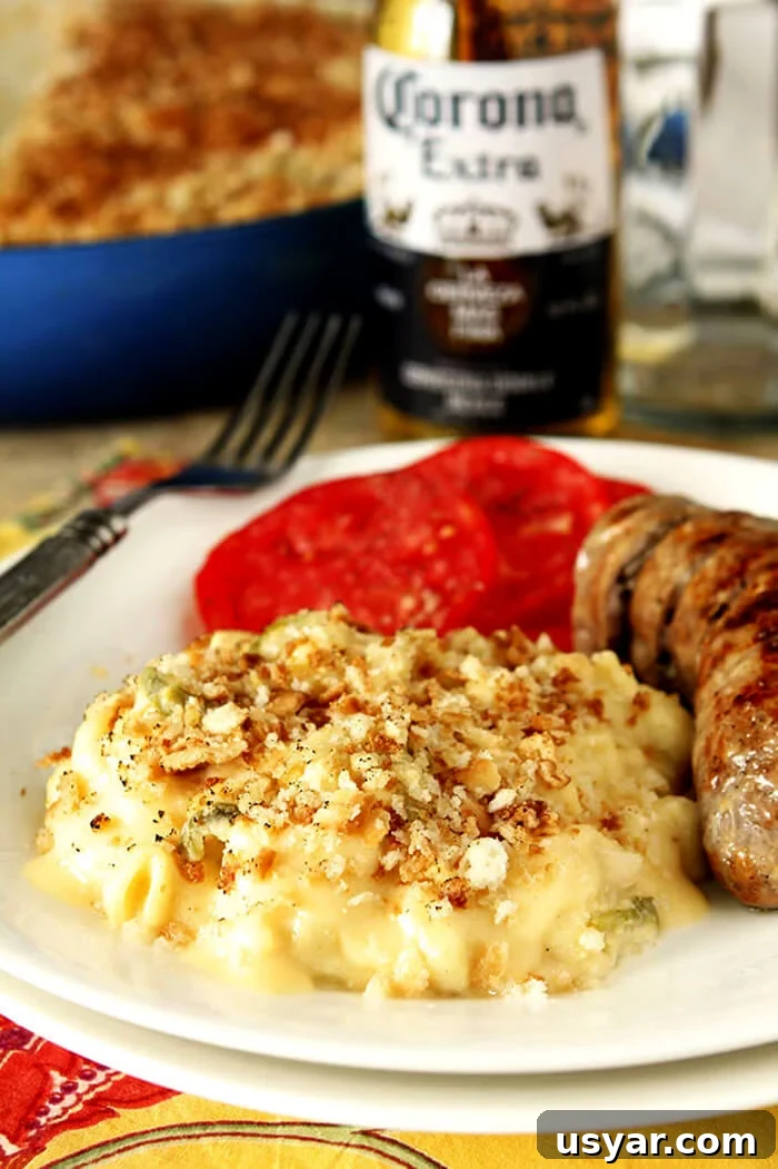 Creamy Hatch Green Chile Mac and Cheese Recipe 2 Macaroni and Cheese with Hatch Green Chiles is Served with Grilled Bratwurst and Tomatoes.