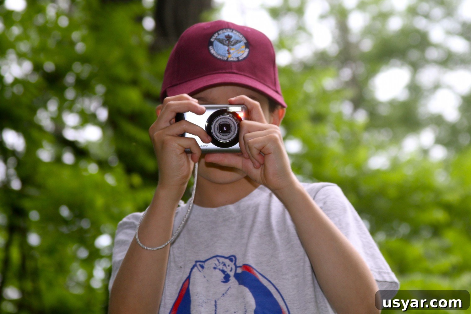 B practices his photography skills