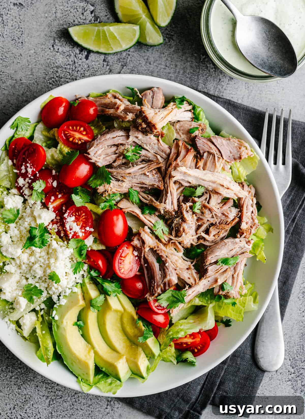 Pulled Pork Salad Recipe with Smoky BBQ Vinaigrette 2 Pulled Pork Salad served in a white bowl and photographed from the top.