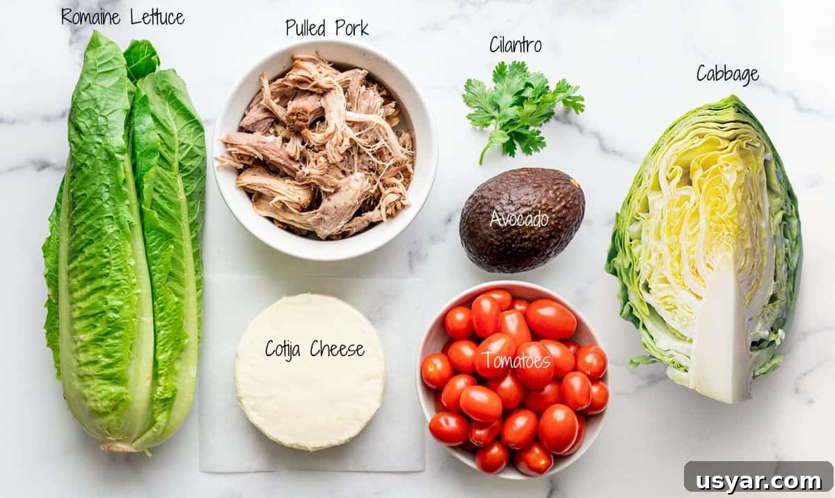 Pulled Pork Salad Recipe with Smoky BBQ Vinaigrette 4 Pulled Pork Salad Ingredients on a white marble board.