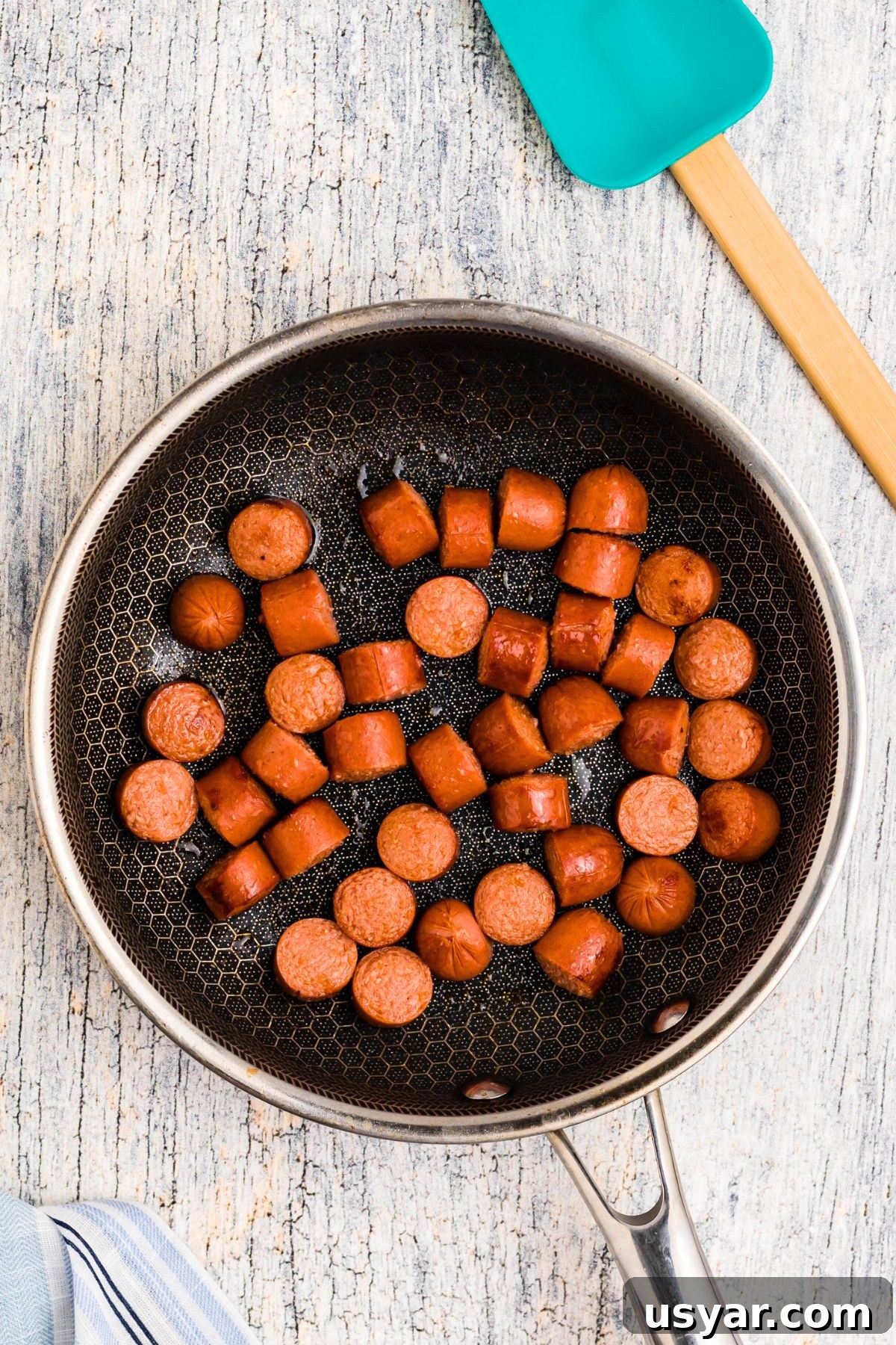 Beanie Weenies Recipe: Classic Hot Dogs in Baked Beans 4 Hot dogs cut into slices, browned in a skillet.