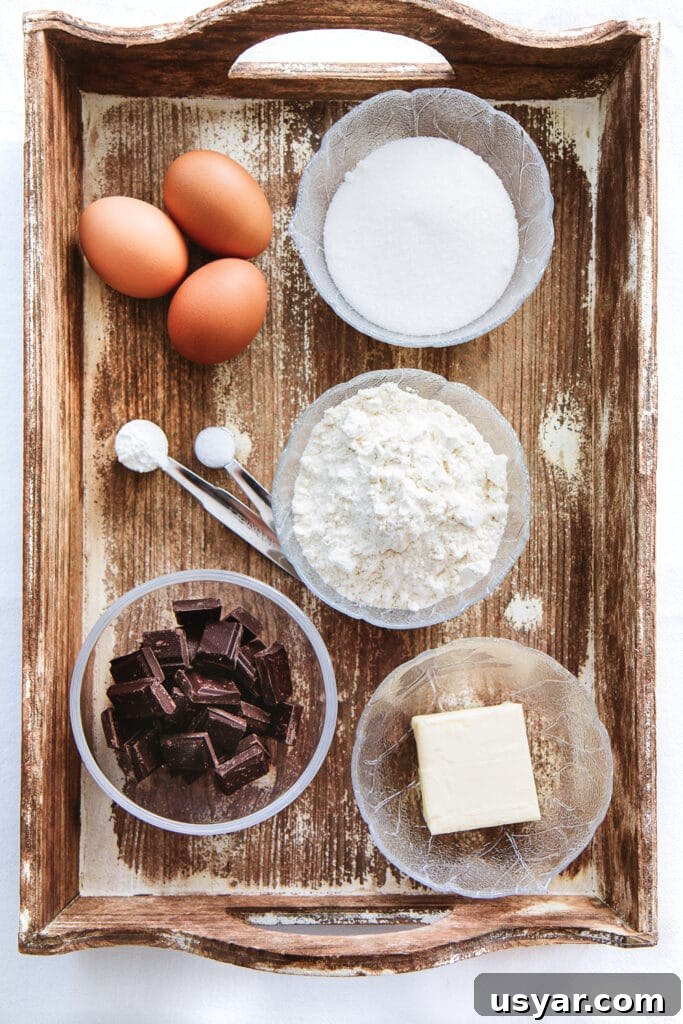 Low-Carb Dessert Baking Tips and Tricks for Perfect Results 13 Pre-measured baking ingredients in bowls on a wooden tray.