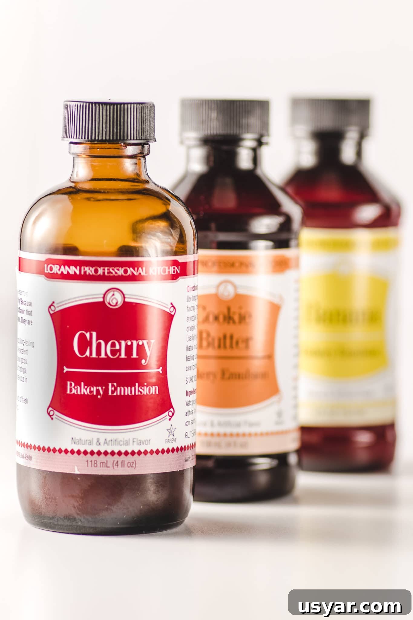 Low-Carb Dessert Baking Tips and Tricks for Perfect Results 4 Three bottles of bakery emulsions on a bright white table.