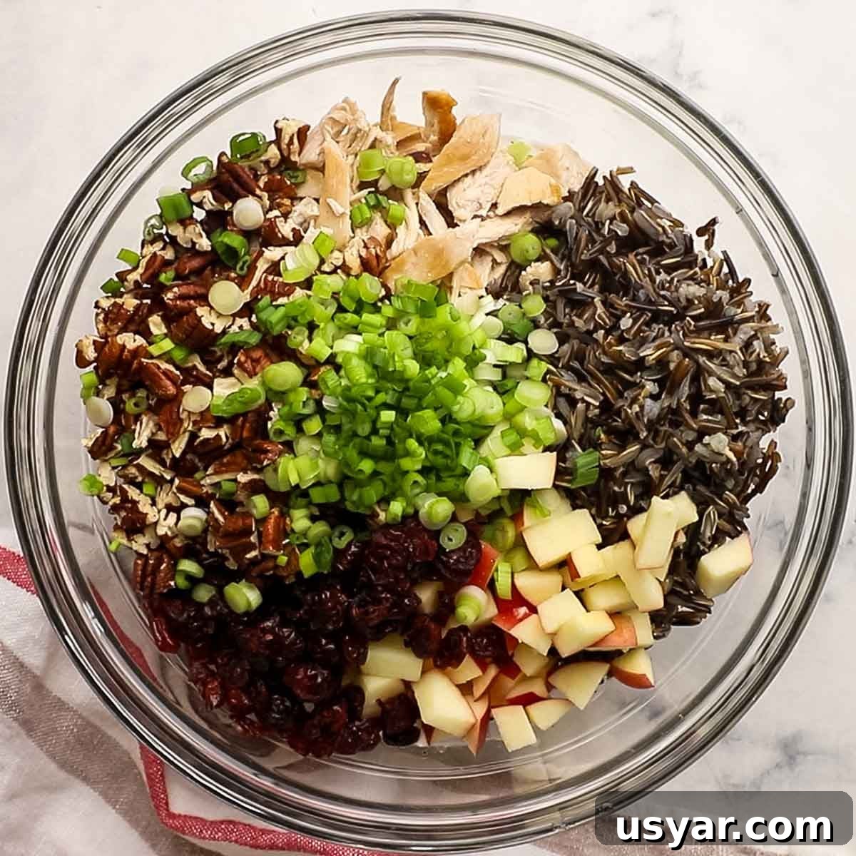 Chicken and Wild Rice Salad Recipe 5 all salad ingredients added to the bowl with the dressing