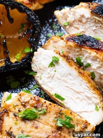 Chicken breast cooked in cast iron skillet and sliced.