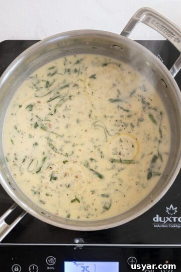 Creamy Lemon Sauce Recipe for Pasta, Chicken and Fish 9 sauce on a low simmer
