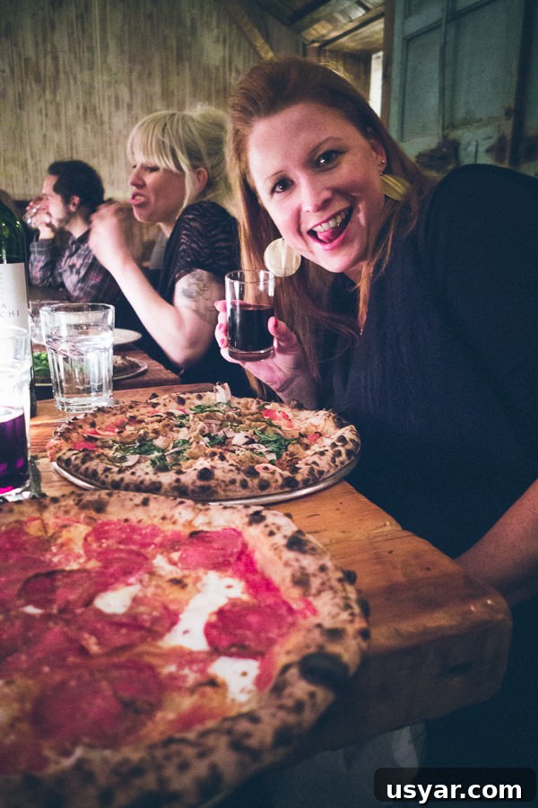 Is This the Pizza Everyone's Raving About in NYC? 11 enjoying the pizza at Paulie Gees pizza Brooklyn New York