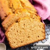 A loaf of peanut butter bread sliced for serving.