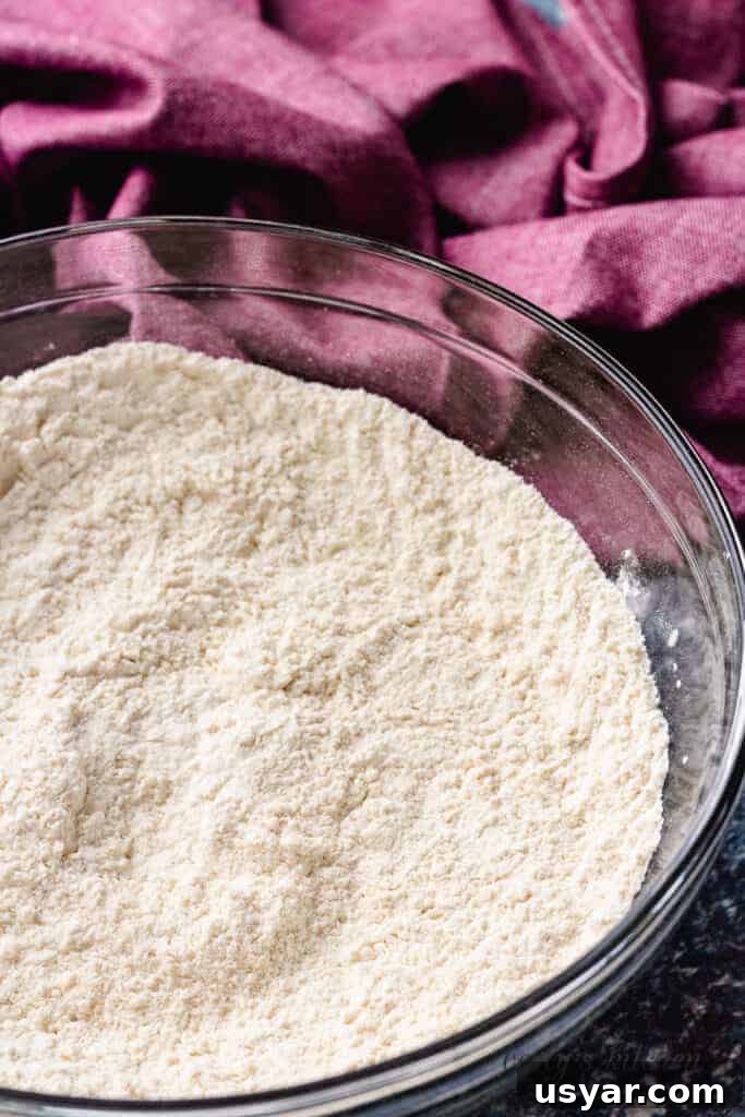 Flour, salt, and baking powder mixed in a bowl.