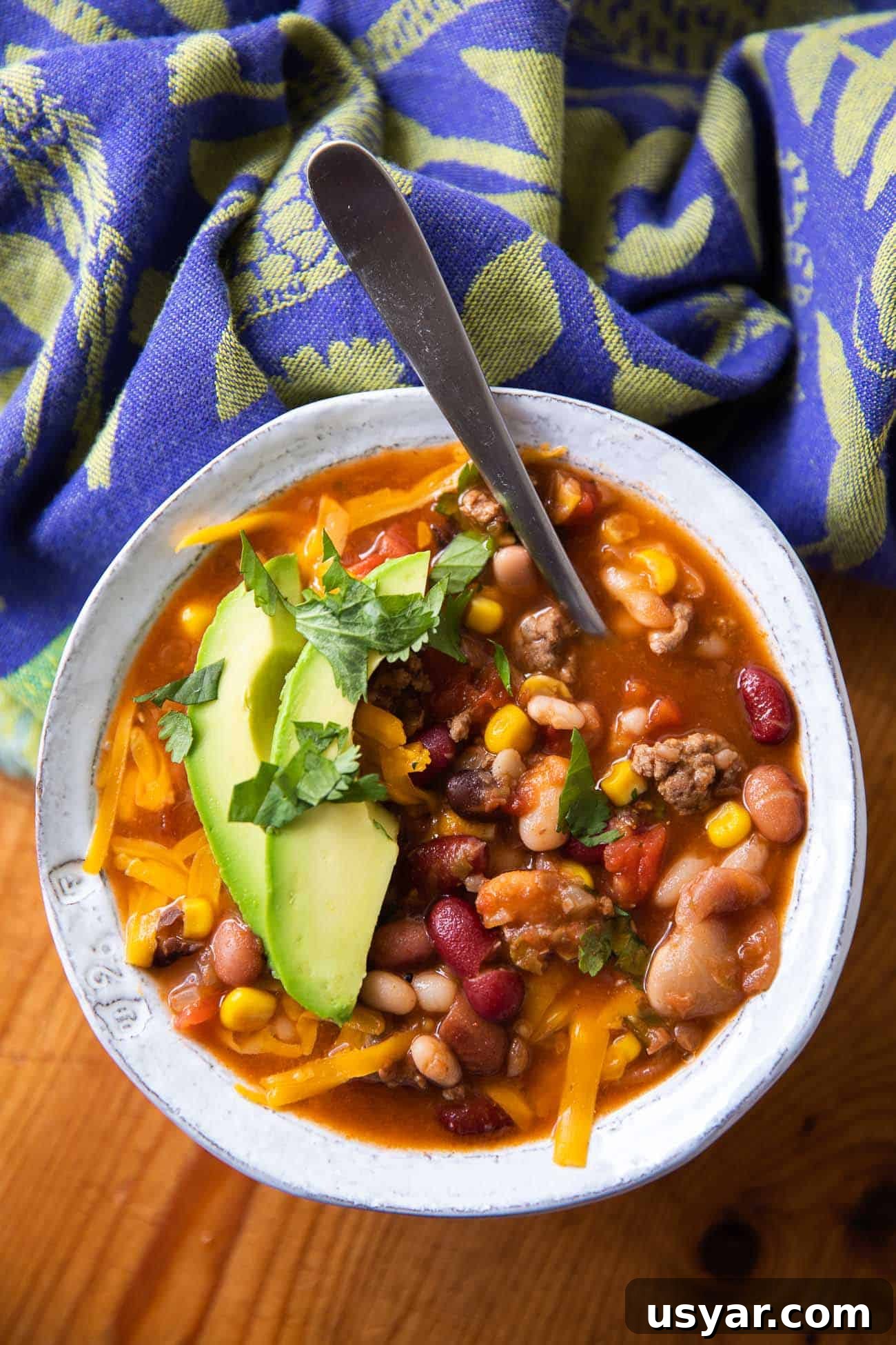 15 Bean Taco Soup Recipe 4 overhead photo of soup with beans, meat and cheese